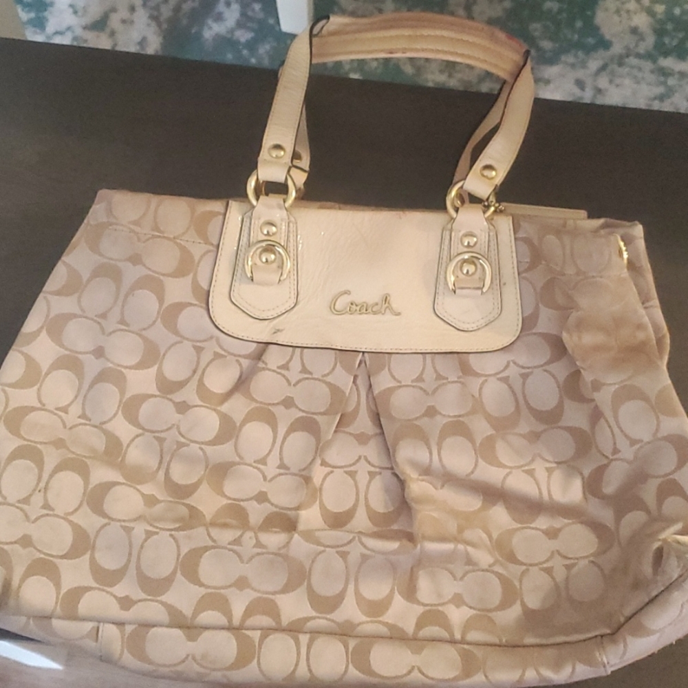 Cream Coach purse with a light pink interior 10.5"L /15" W